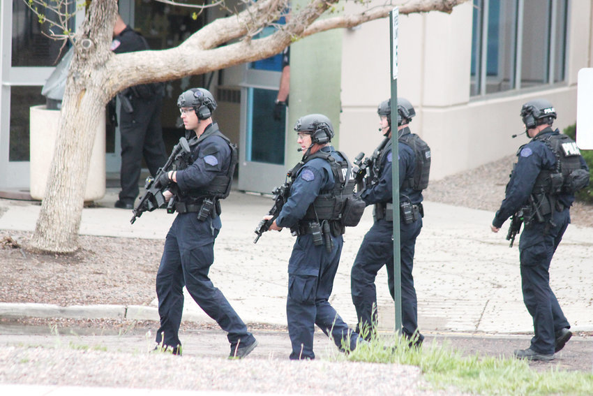 Law enforcement personnel respond to STEM School Highlands Ranch on May 7. One student was killed and eight were wounded. Two students were arrested on suspicion of carrying out the attack.